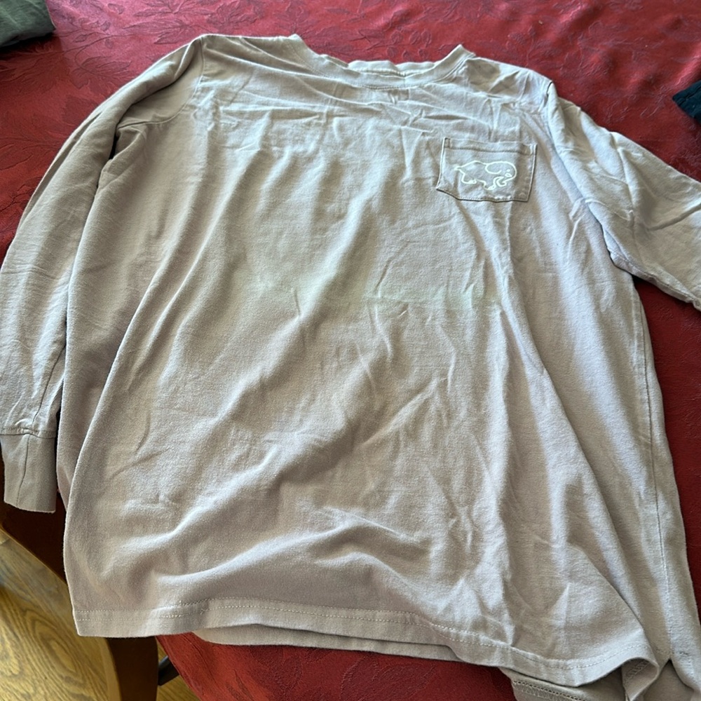 Long sleeve t shirt pocket in front and design on back the color is light mauve